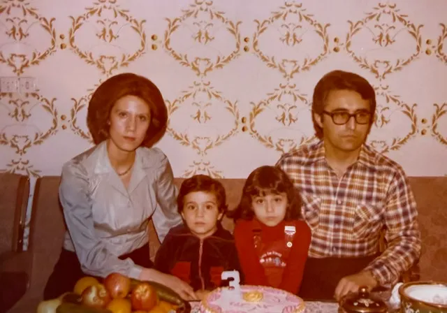 Family portrait at a child's third birthday party.