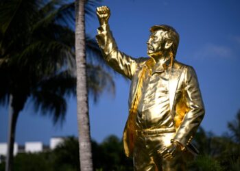 A golden statue of Trump draws mixed reactions at his golf course