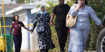 Slain mosque security guard had warned teachers to lock doors, imam says