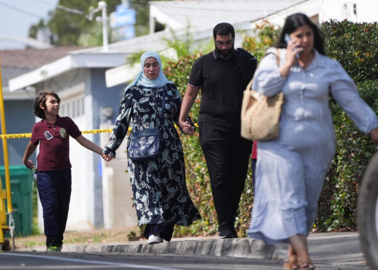 Slain mosque security guard had warned teachers to lock doors, imam says