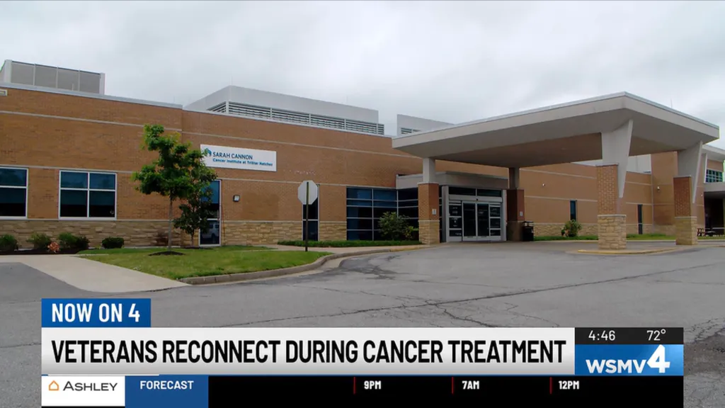 Exterior of the Sarah Cannon Cancer Institute at TriStar Natchez building, with a news chyron at the bottom reading 