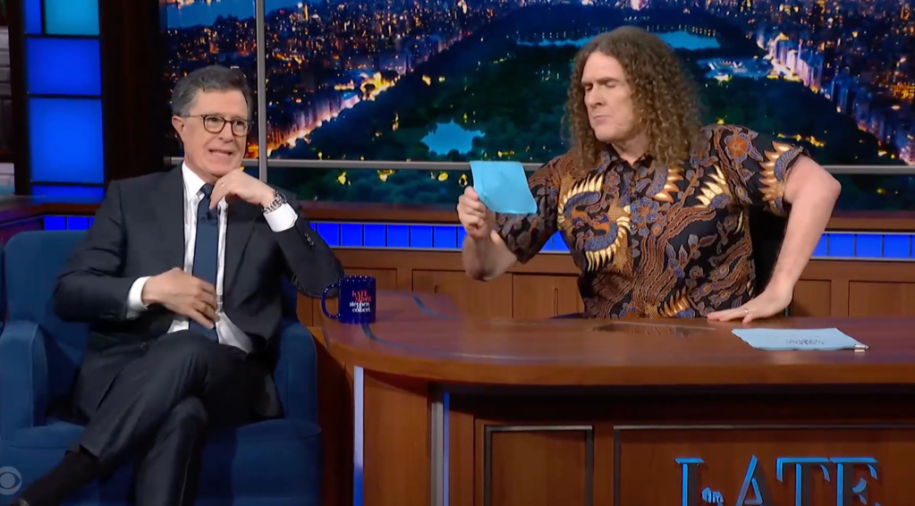 Stephen Colbert interviewing