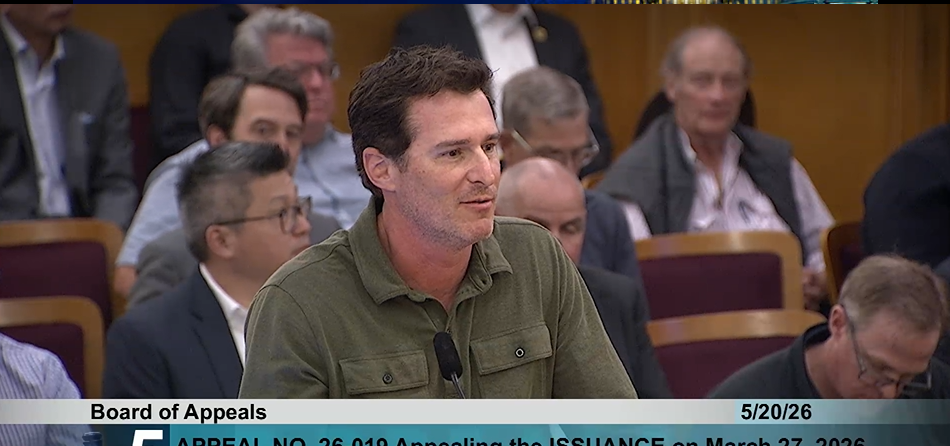 A man speaking at a Board of Appeals meeting.