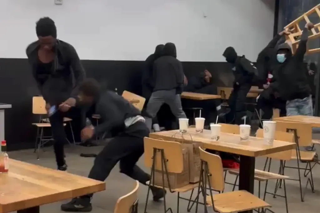 People in a dining area during a violent confrontation.