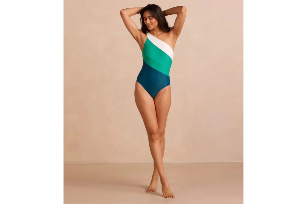 A woman in a one-shoulder swimsuit for long torsos.