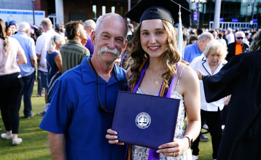 Firefighter travels 600 miles to college graduation of baby he helped deliver years ago