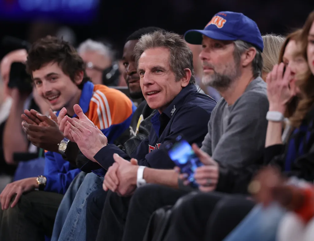 Ben Stiller and Timothée Chalamet watching an NBA basketball game.