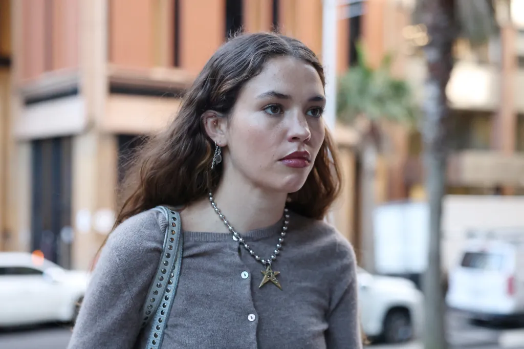 Actor Charlotte MacInnes returning to court after a lunch break during a defamation hearing.