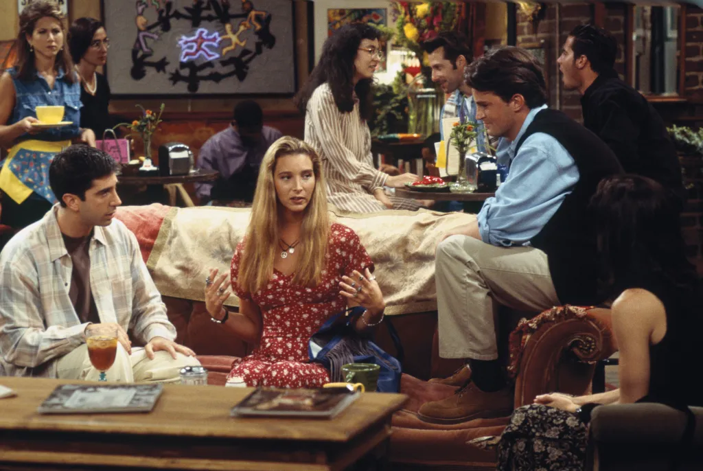 Actors from 'Friends' sitting together in Central Perk.