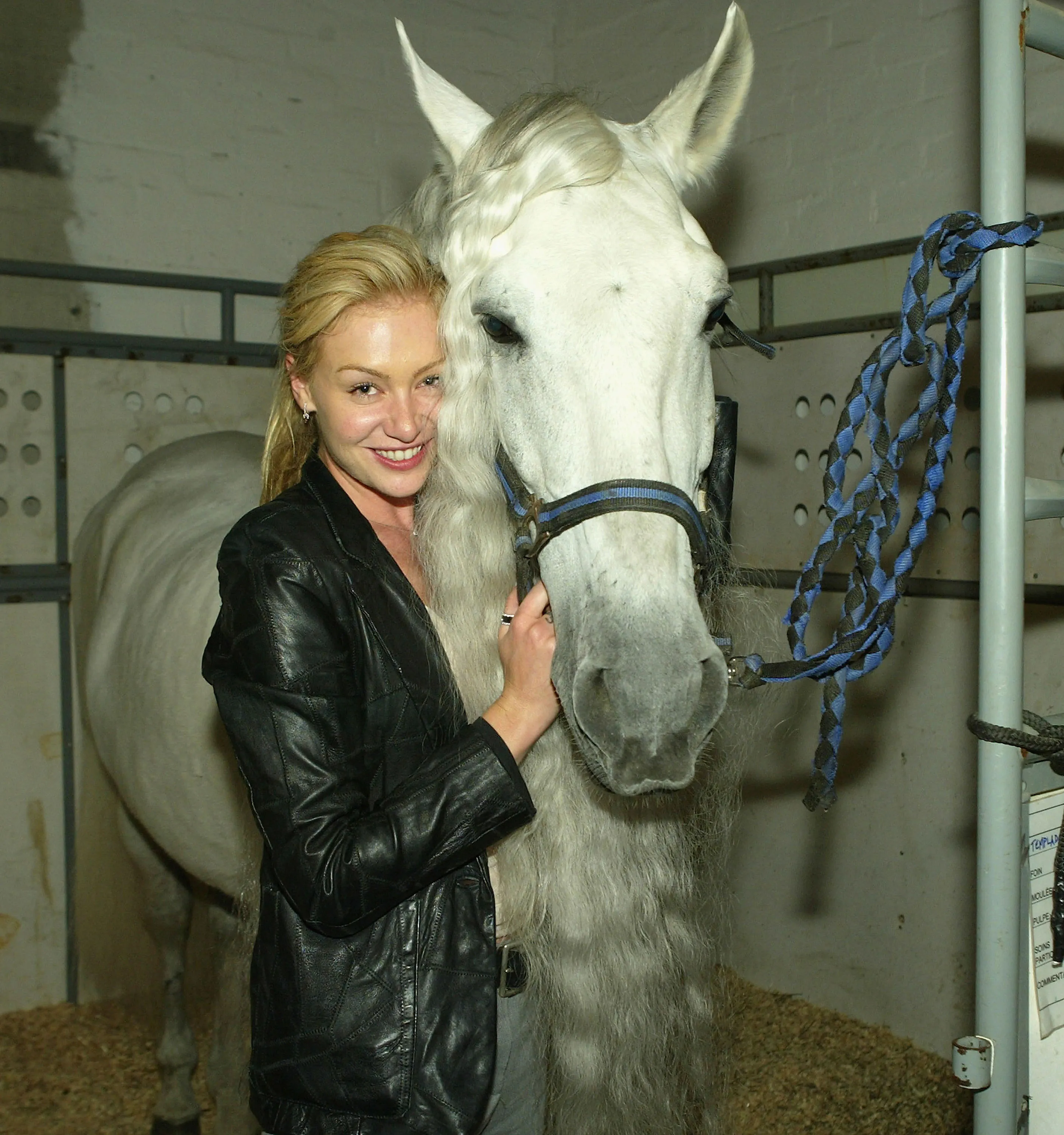 Portia de Rossi poses with Templado, a white horse.