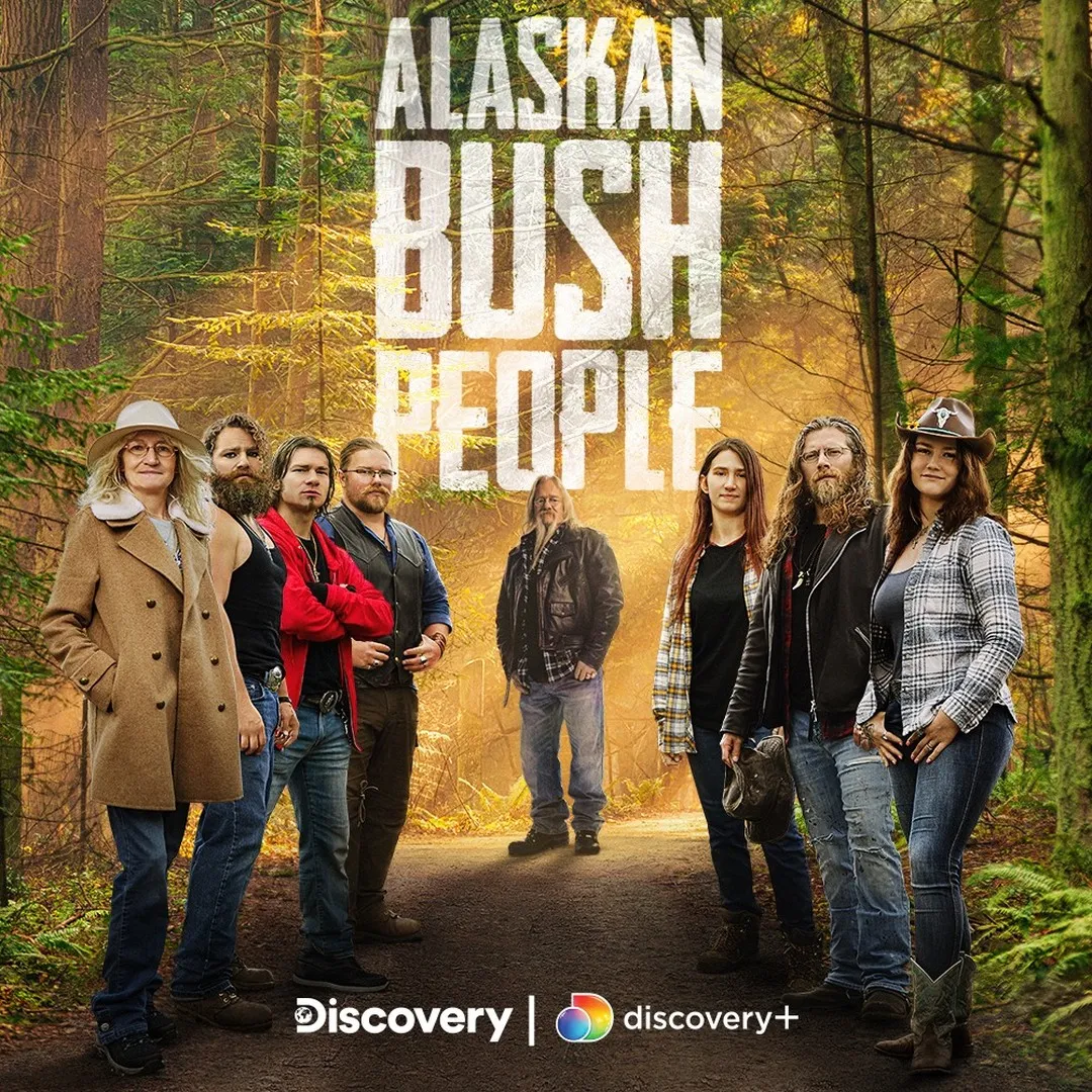 The cast of Alaskan Bush People standing on a dirt road in a forest.