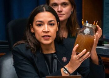 AOC brandishes jars of filthy water as she shames Trump official