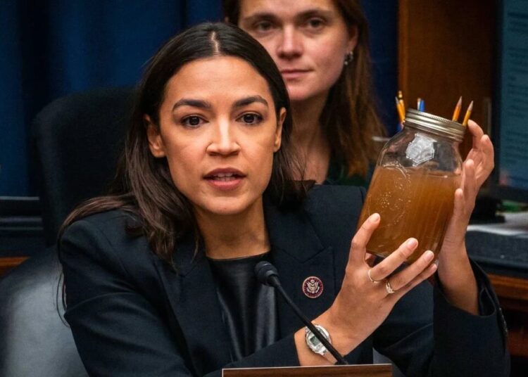 AOC brandishes jars of filthy water as she shames Trump official