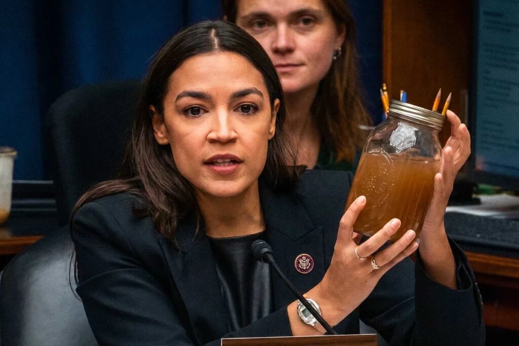 AOC brandishes jars of filthy water as she shames Trump official