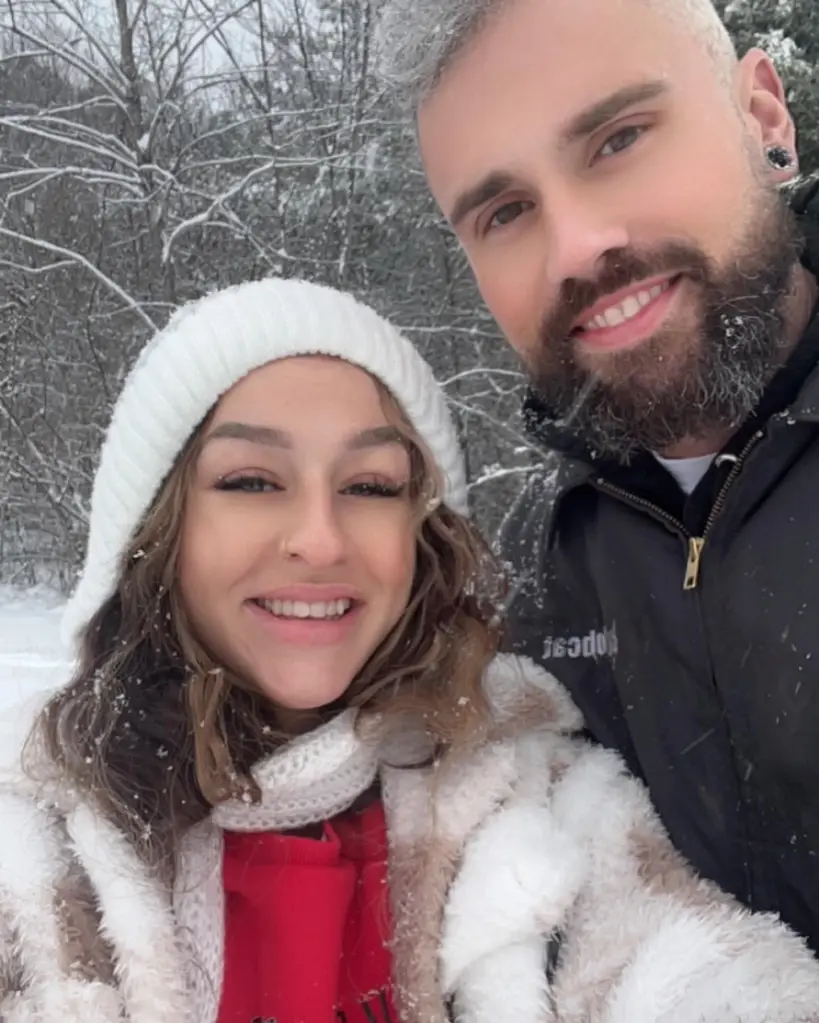 Amanda Conner and Ryan Edwards smiling in a snowy outdoor setting.