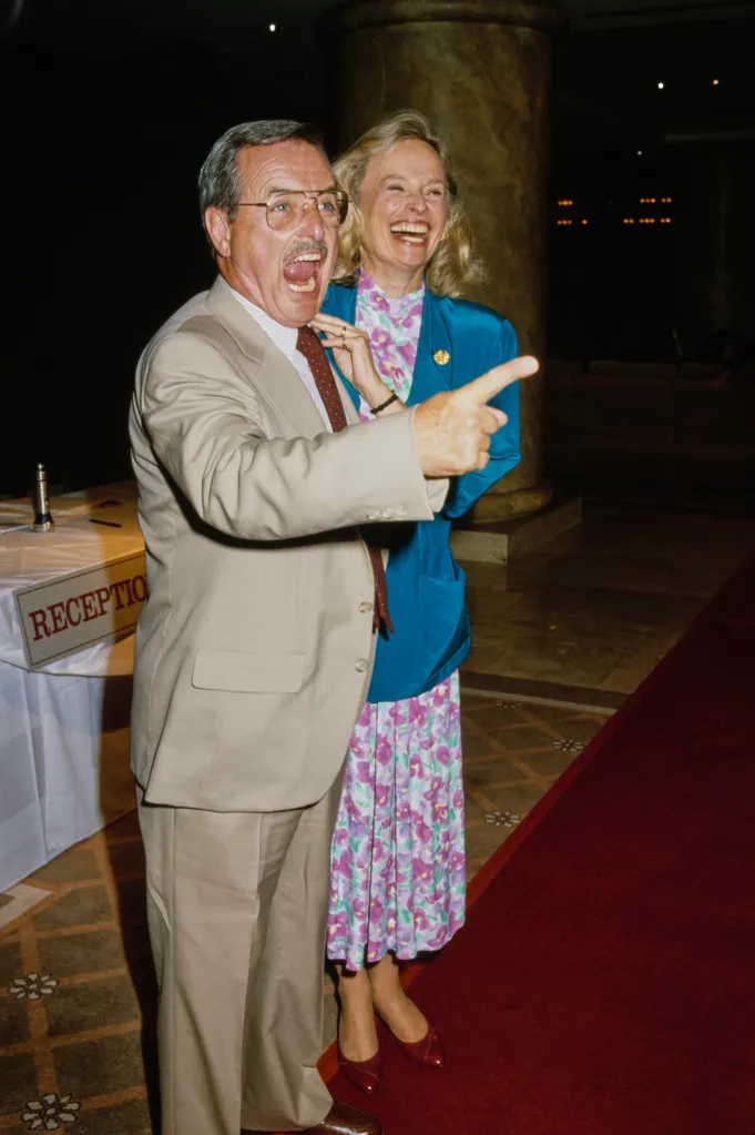 American actor William Daniels and his wife Bonnie Bartlett, smiling and pointing.