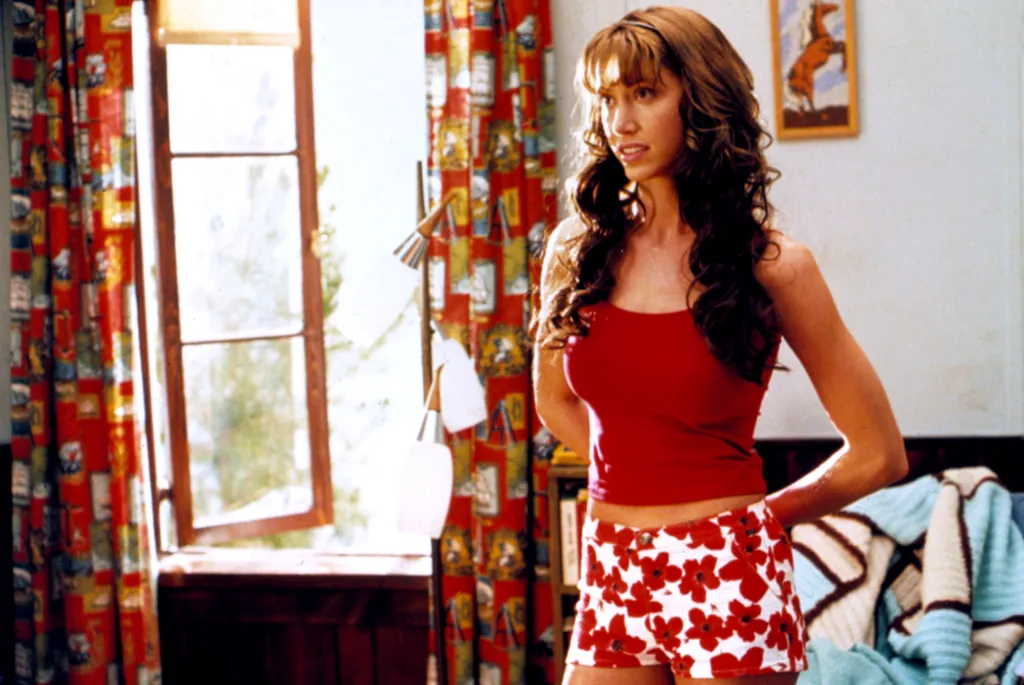Shannon Elizabeth as Nadia in American Pie 2, wearing a red tank top and floral shorts.