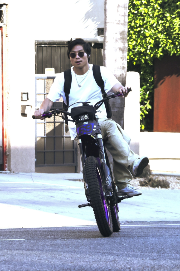 Pax Jolie-Pitt on an electric bike.