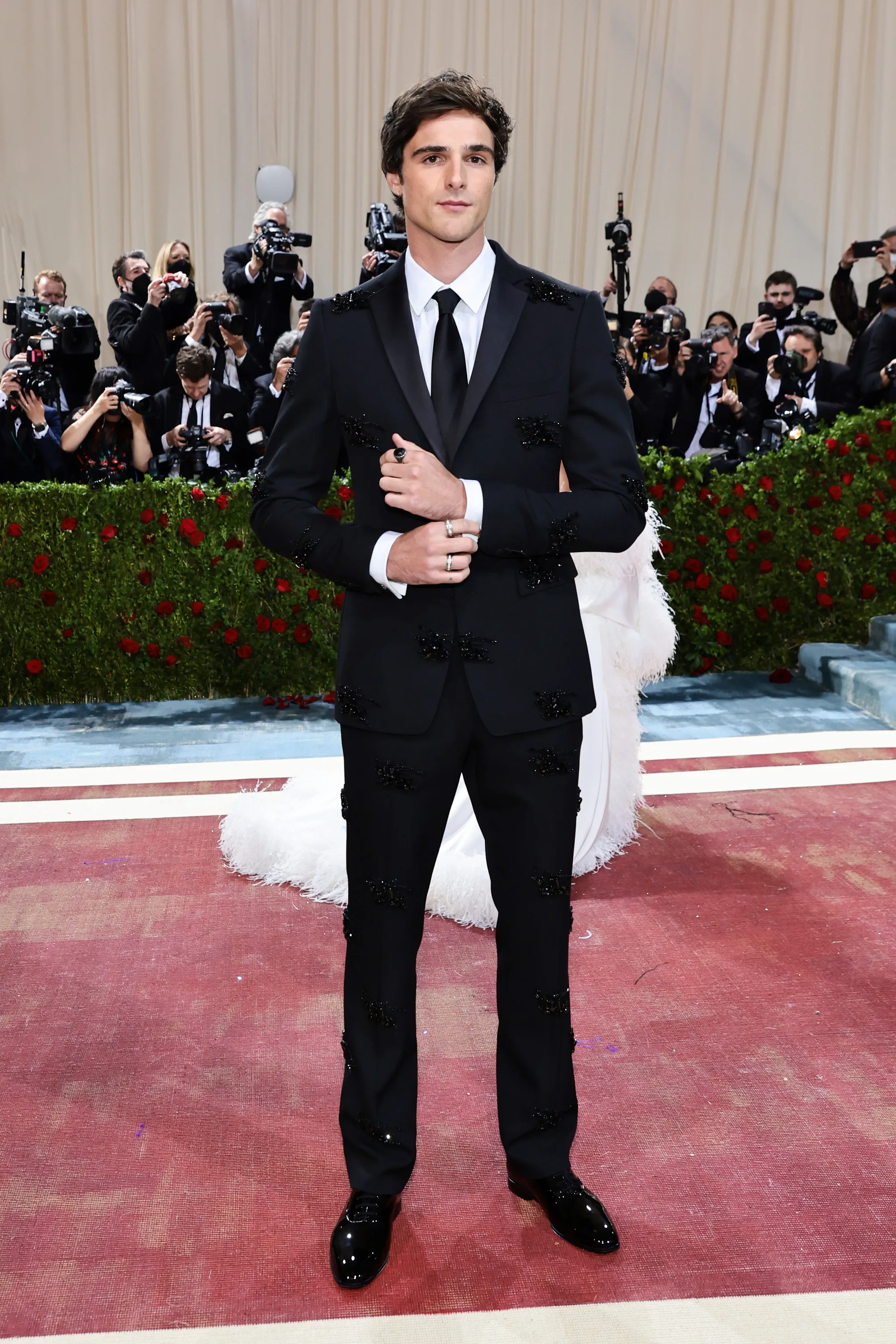 Jacob Elordi attends The 2022 Met Gala in a black suit with black embellishments.