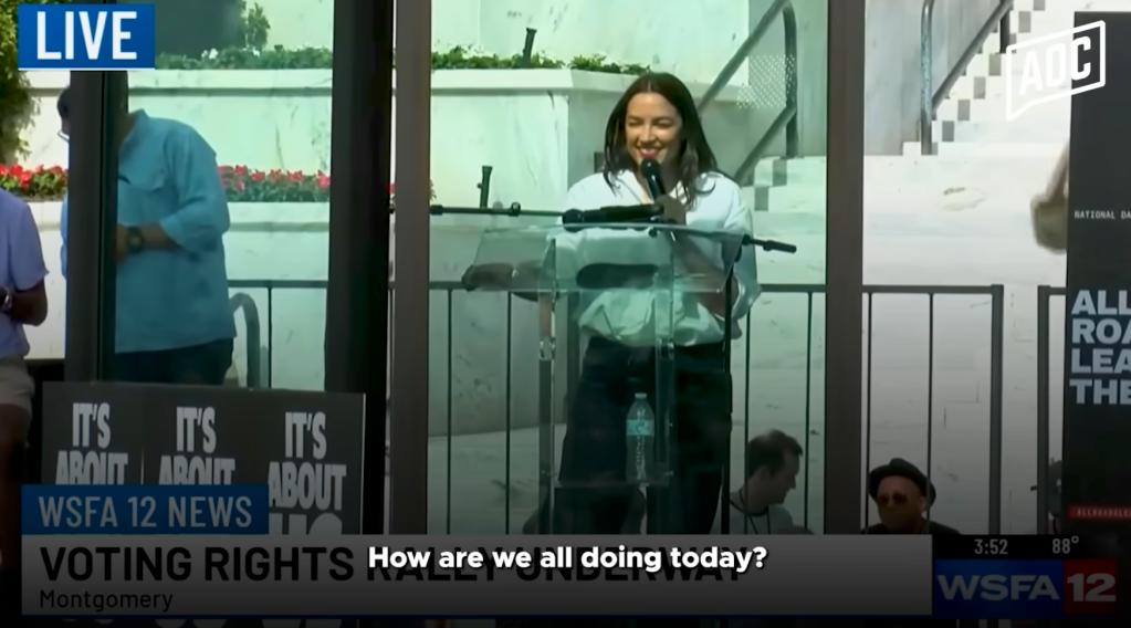 AOC addressing a crowd at a voting rights rally in Montgomery, Alabama.