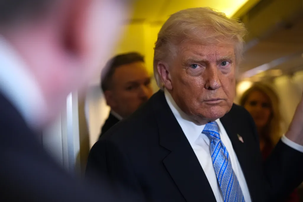 President Donald Trump speaking to reporters aboard Air Force One.