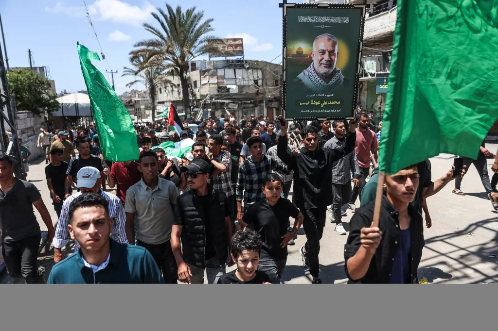 Mourners carry the body of Hamas leader Mohammed Odeh and other Palestinians during their funeral in Gaza City.