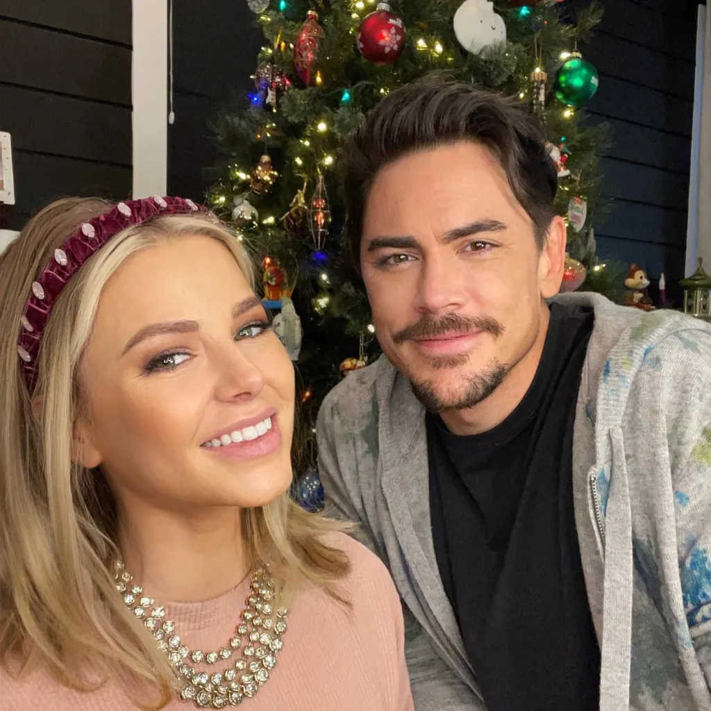 Ariana Madix and Tom Sandoval in front of a Christmas tree.