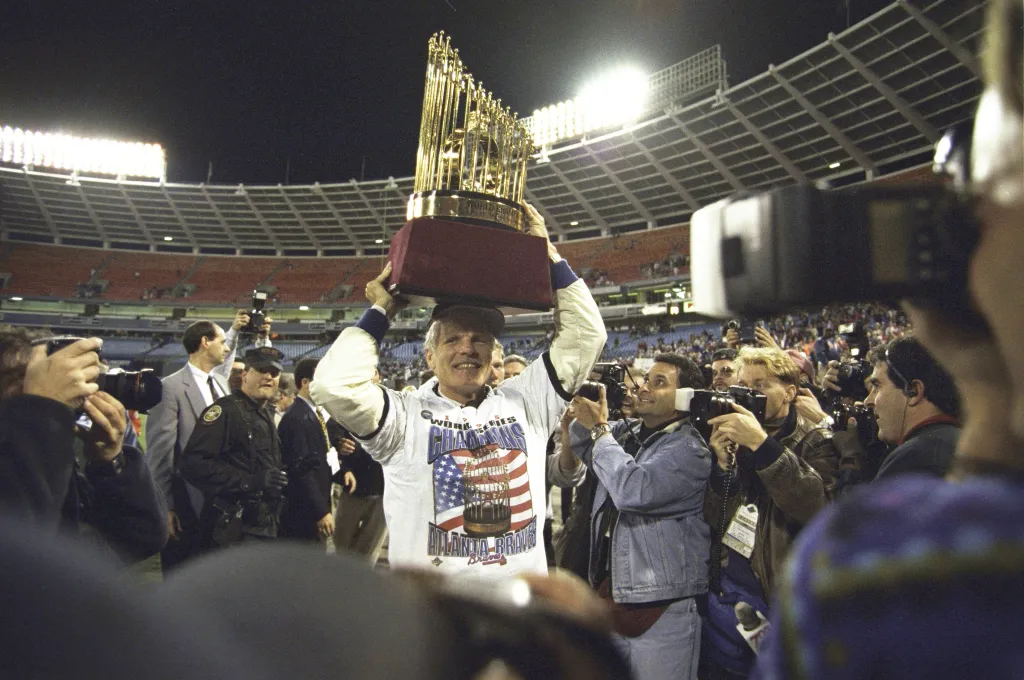 Atlanta Braves owner Ted Turner hoisting the Commissioner's Trophy after winning the World Series.