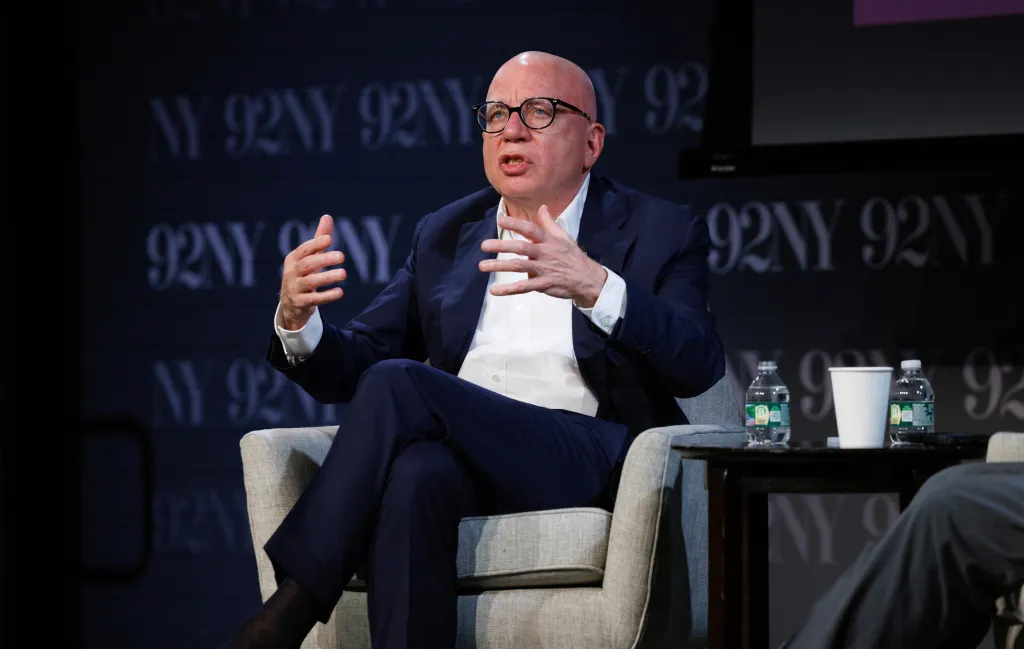 Author Michael Wolff speaking at an event.