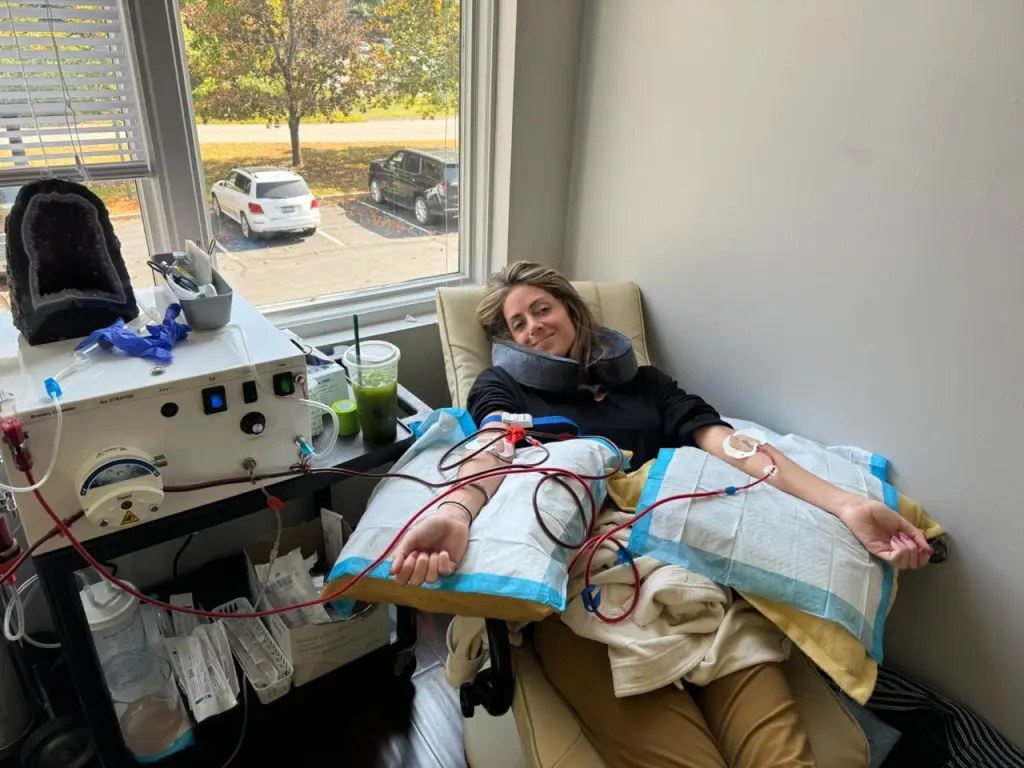 Alexa Greenfield with a neck pillow undergoes plasmapheresis for an autoimmune disease.