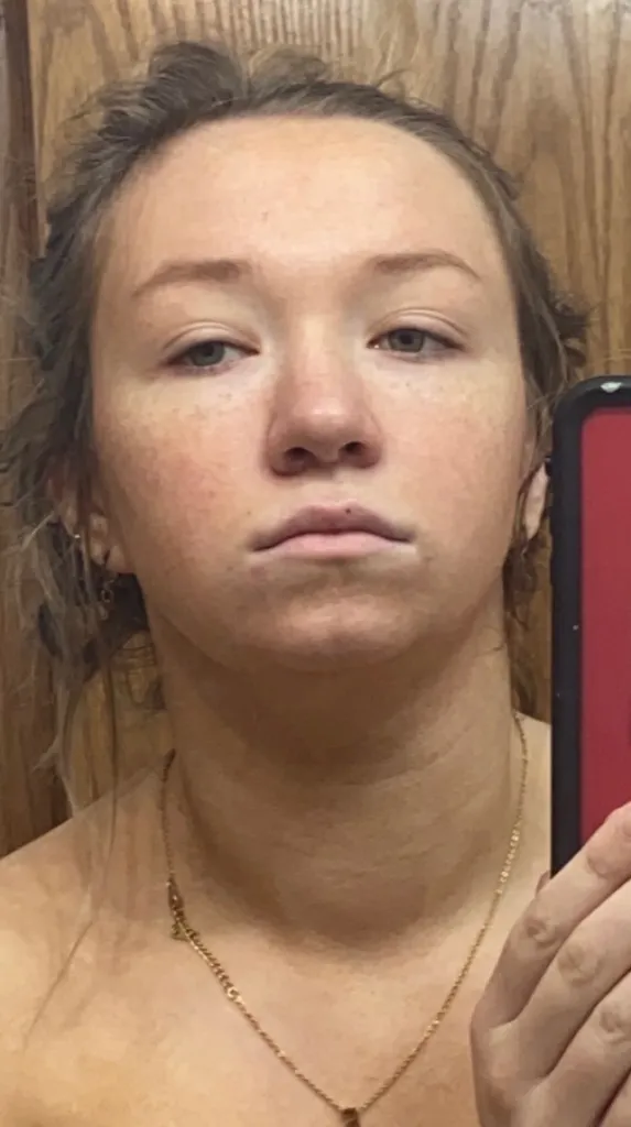 Jenna Lee Jane with droopy eyelids and a flat expression.