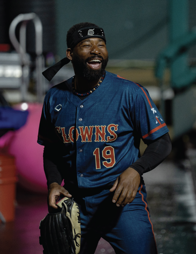 photo of man in blue/red Clowns uniform laughing