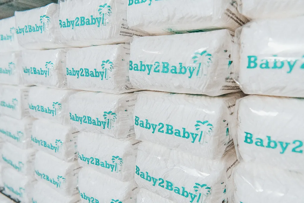 A stack of Baby2Baby diaper packages.
