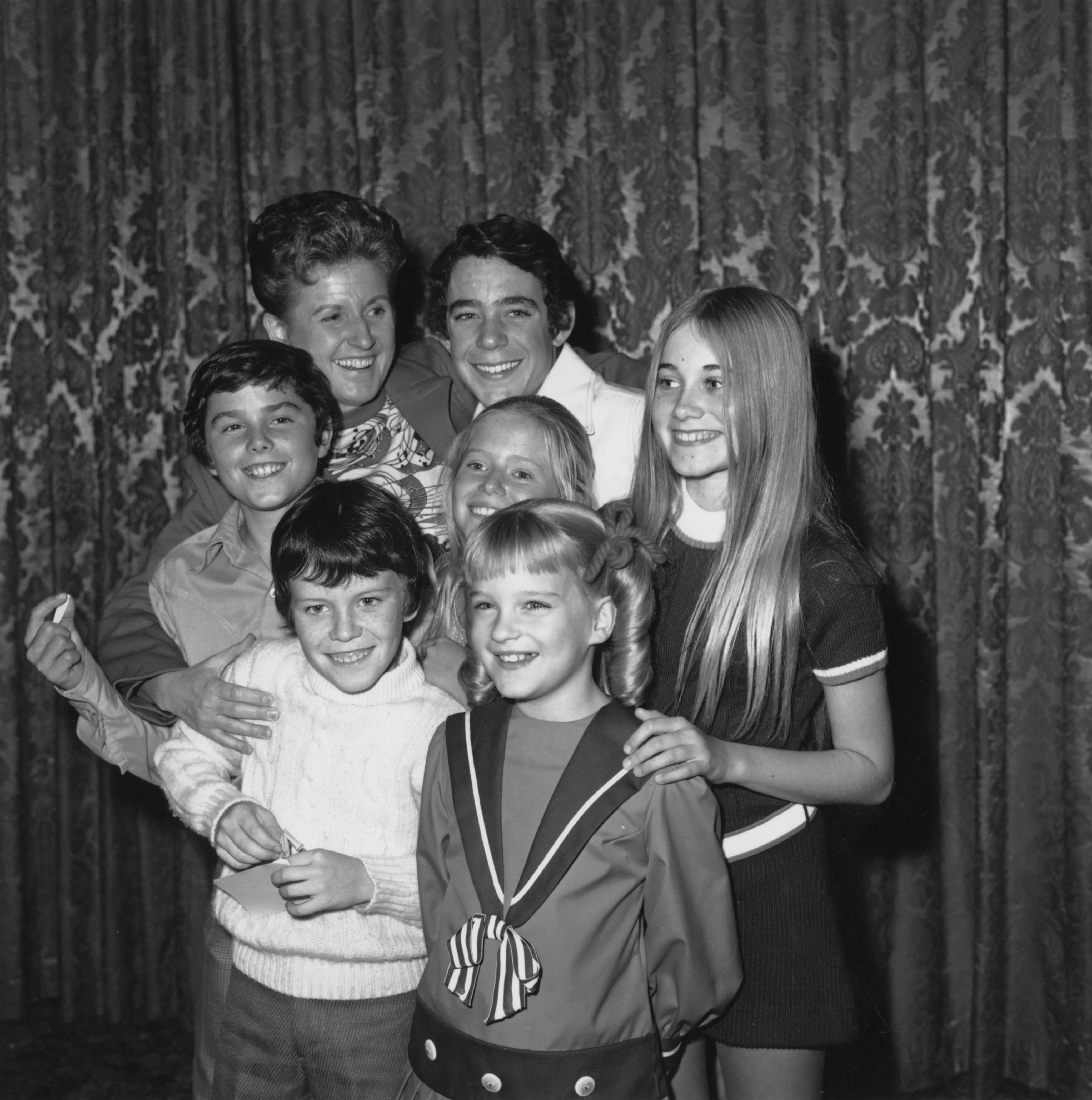Ann B. Davis and the child cast of The Brady Bunch.