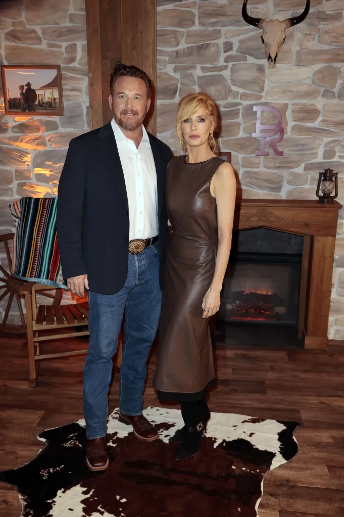 Cole Hauser and Kelly Reilly posing in a Western-themed room at the Berlin special screening of 'Dutton Ranch'.