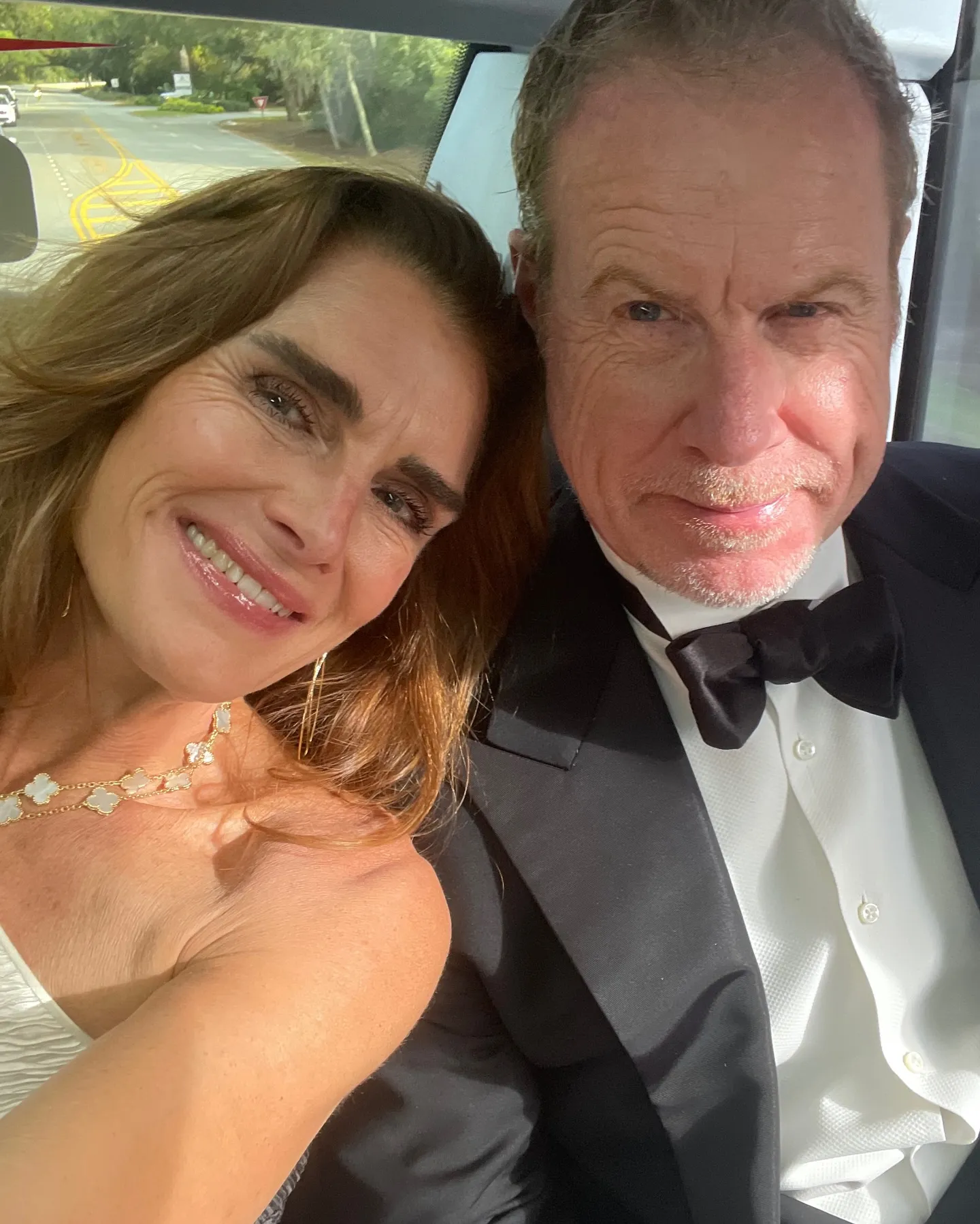 Brooke Shields and Chris Henchy posing for a selfie in formal wear.