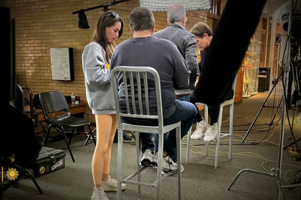 A group of people sitting at a table during an interview.