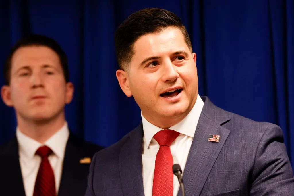 First Assistant U.S. Attorney Bill Essayli speaking at a press conference on fraud in California.