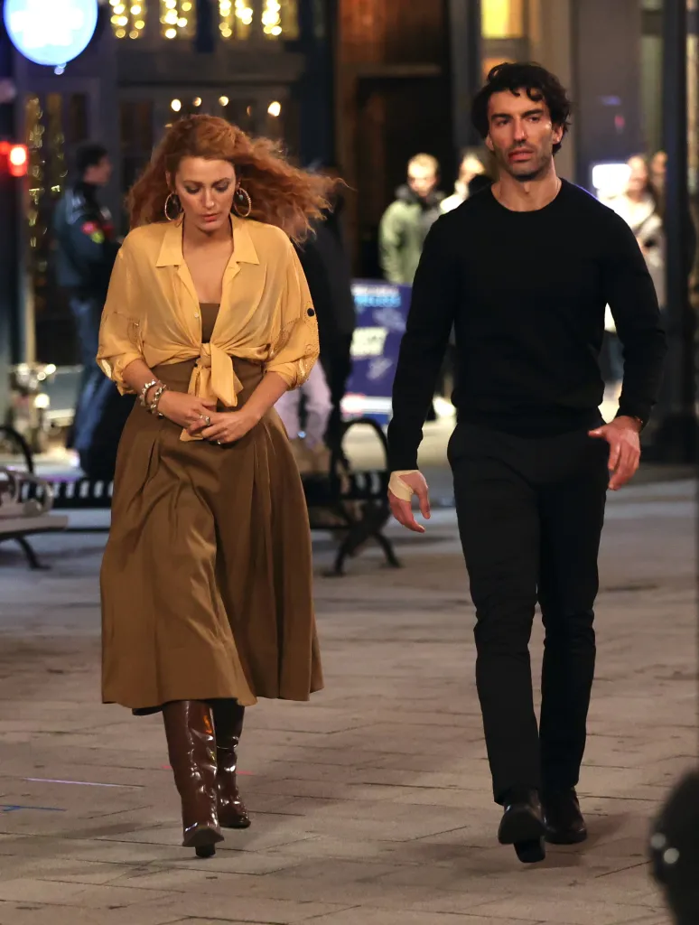 Blake Lively and Justin Baldoni walking on set.