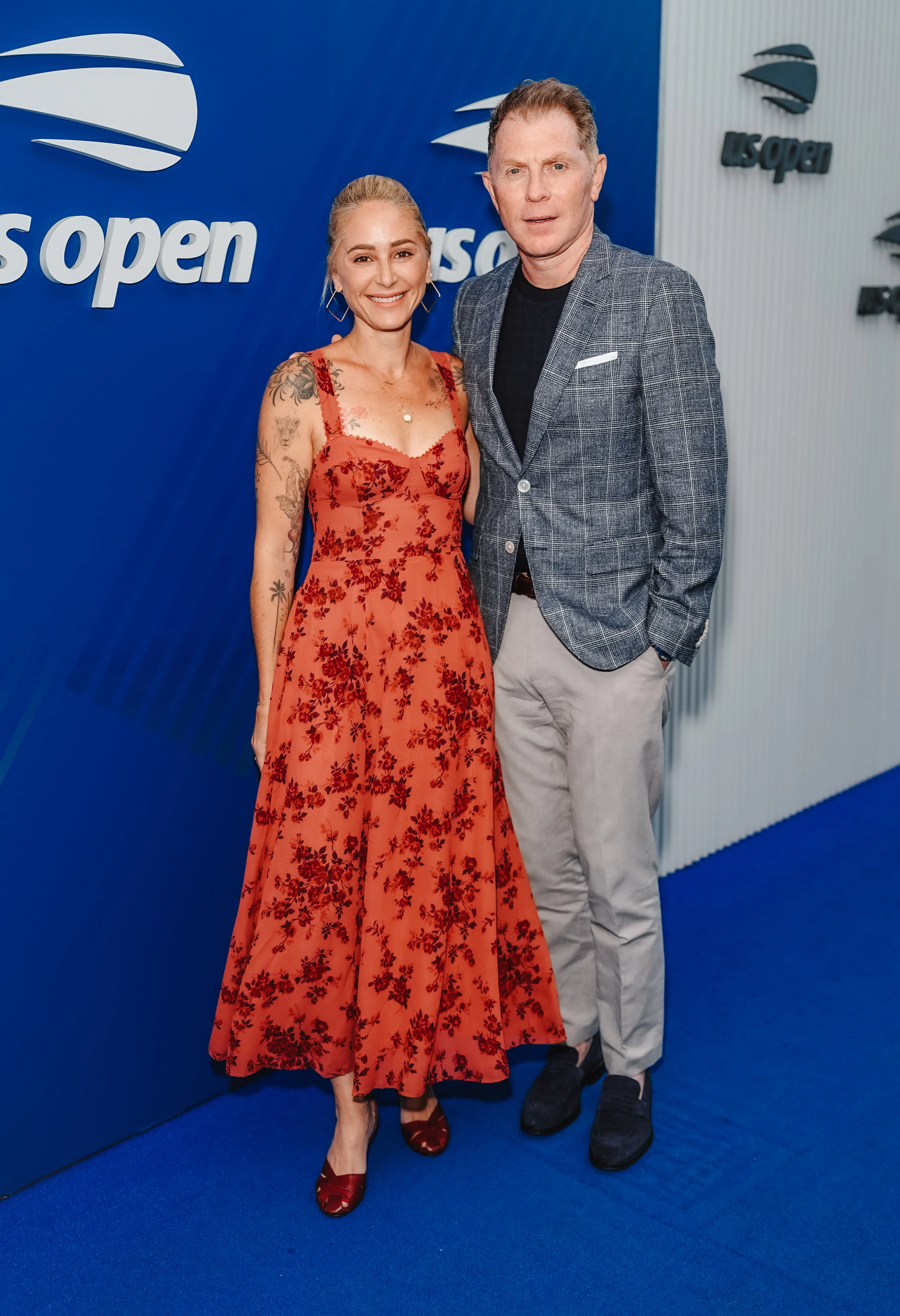 Bobby Flay and Brooke Williamson pose at the US Open.