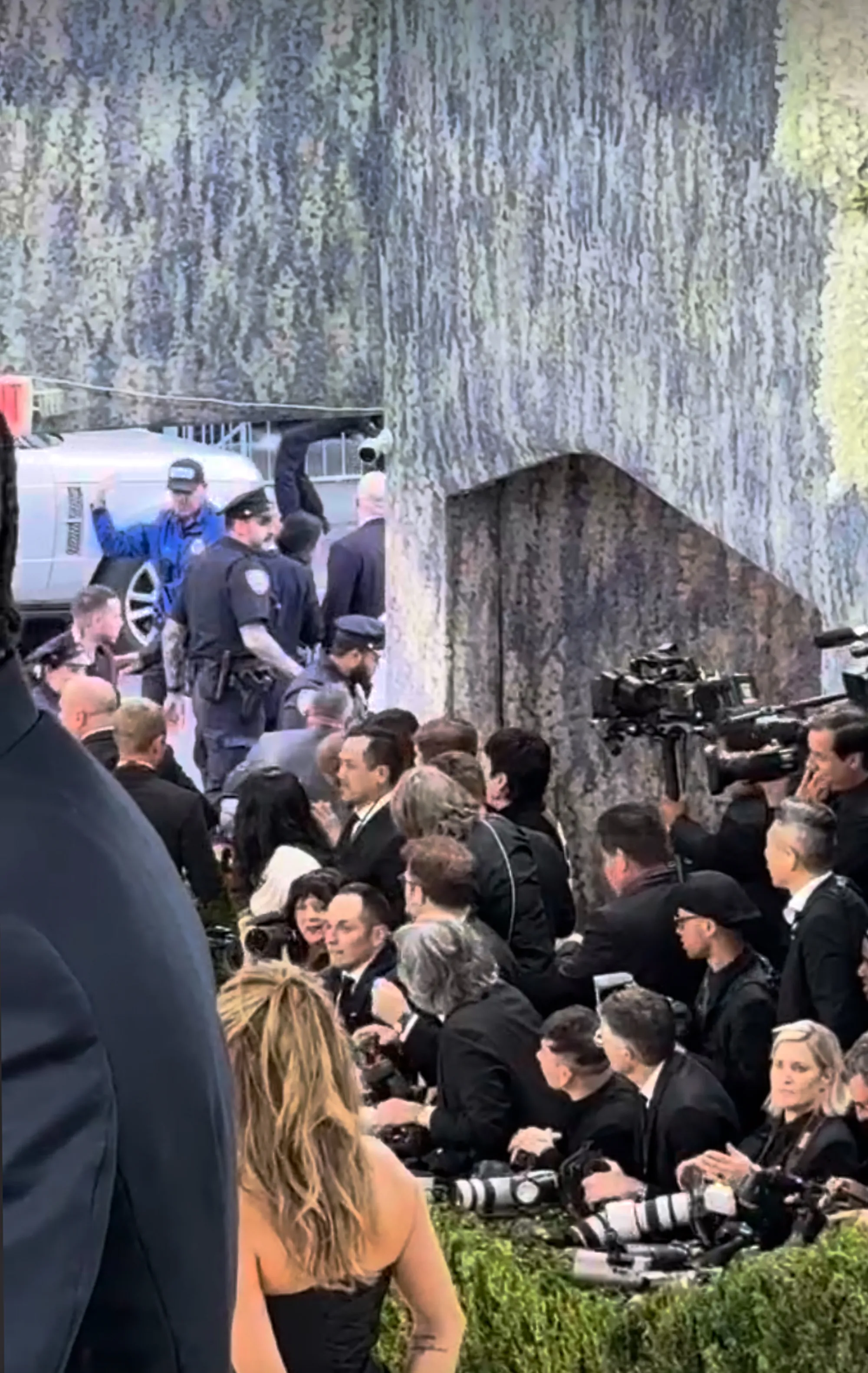 Chaos at the Met Gala as a protester is apprehended by police near the red carpet.