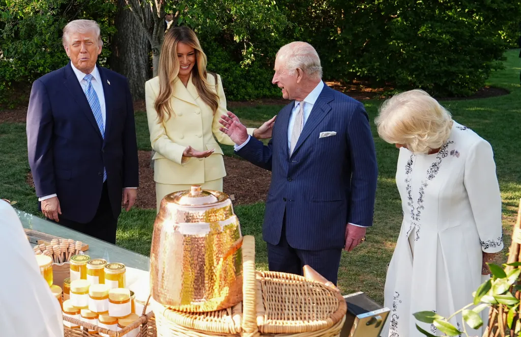 King Charles and Queen Camilla with Donald Trump and Melania Trump inspecting beehives and honey products at the White House.