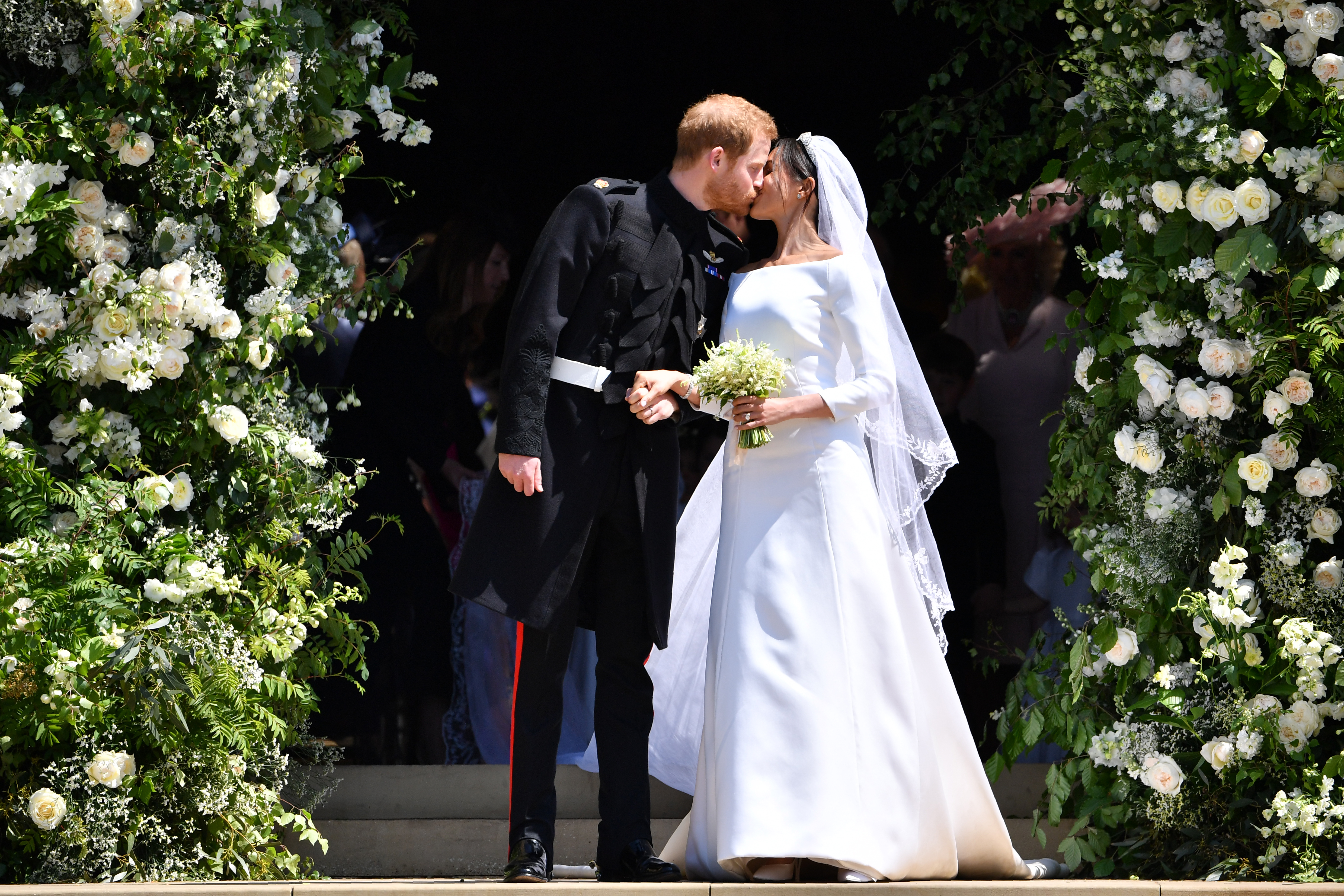 Prince Harry and Meghan Markle kissing at their wedding.