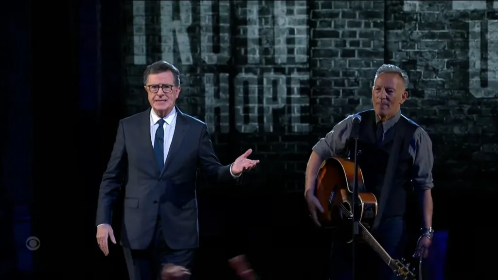 Stephen Colbert and Bruce Springsteen performing on