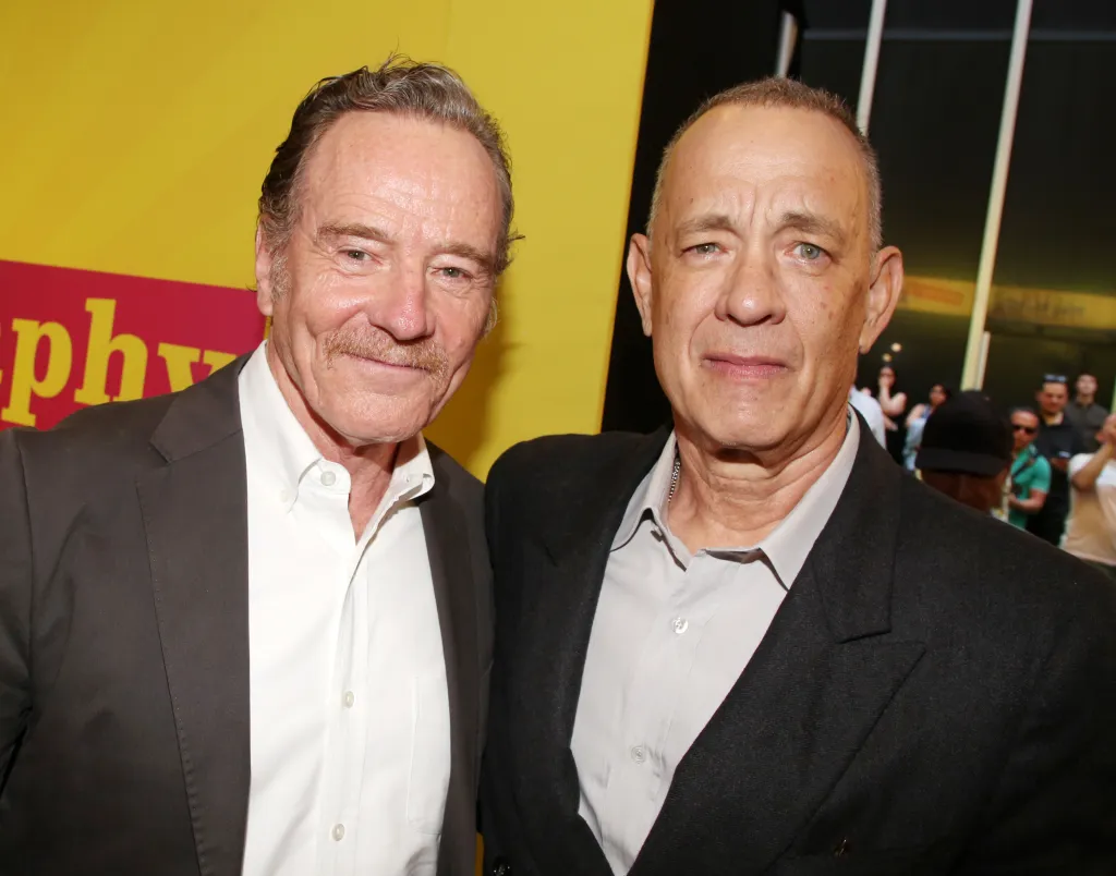 Bryan Cranston and Tom Hanks pose at the opening night of