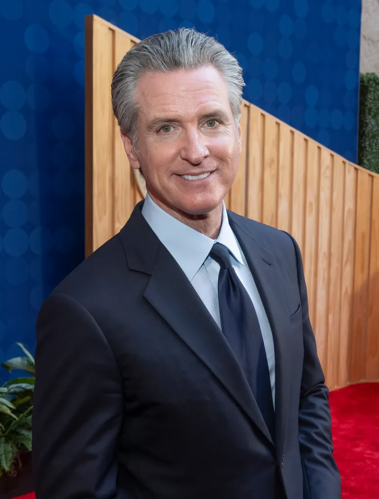California Governor Gavin Newsom smiling at the 19th Annual California Hall of Fame Ceremony.