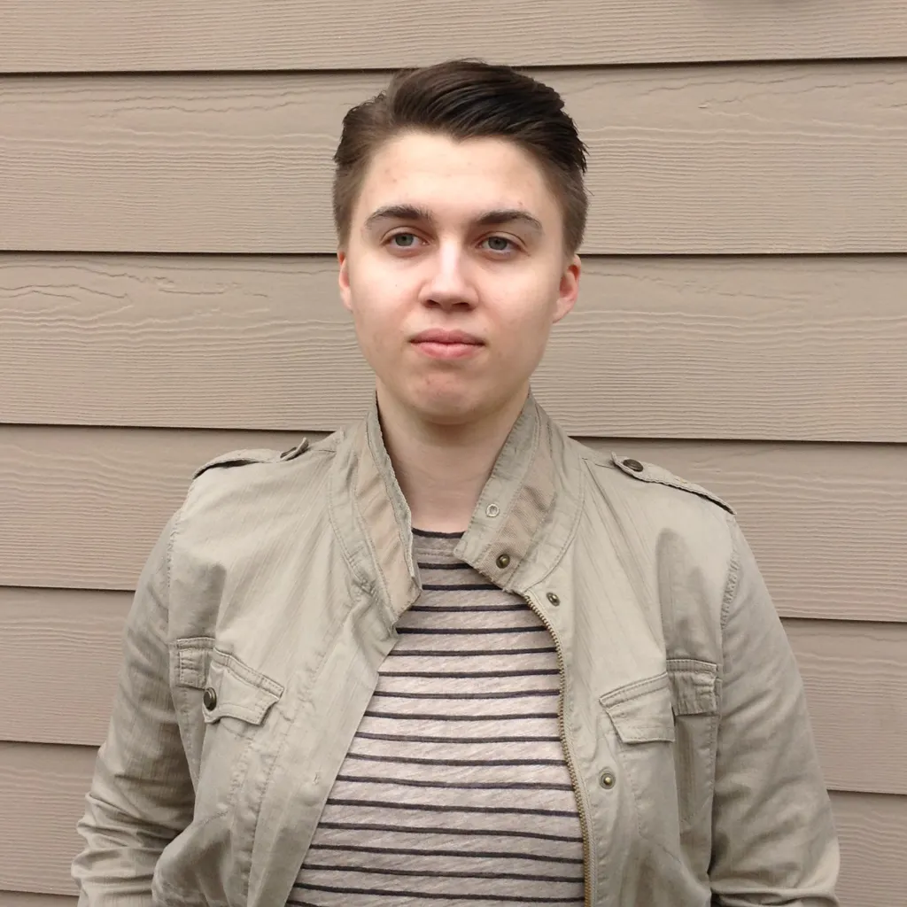 Camille Kiefel in a beige jacket over a striped shirt.