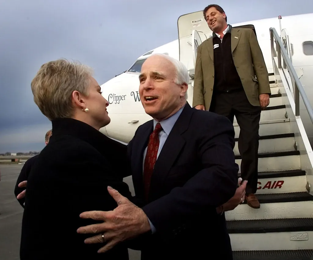 John McCain greets his wife, Cindy, at an airport in Syracuse, New York.