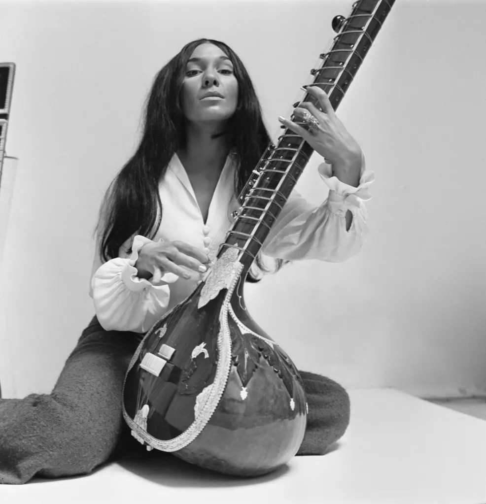 Buffy Sainte-Marie playing a sitar.