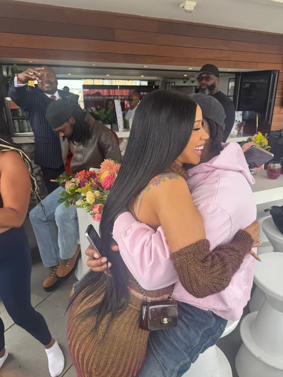 Cardi B and Stefon Diggs embracing.
